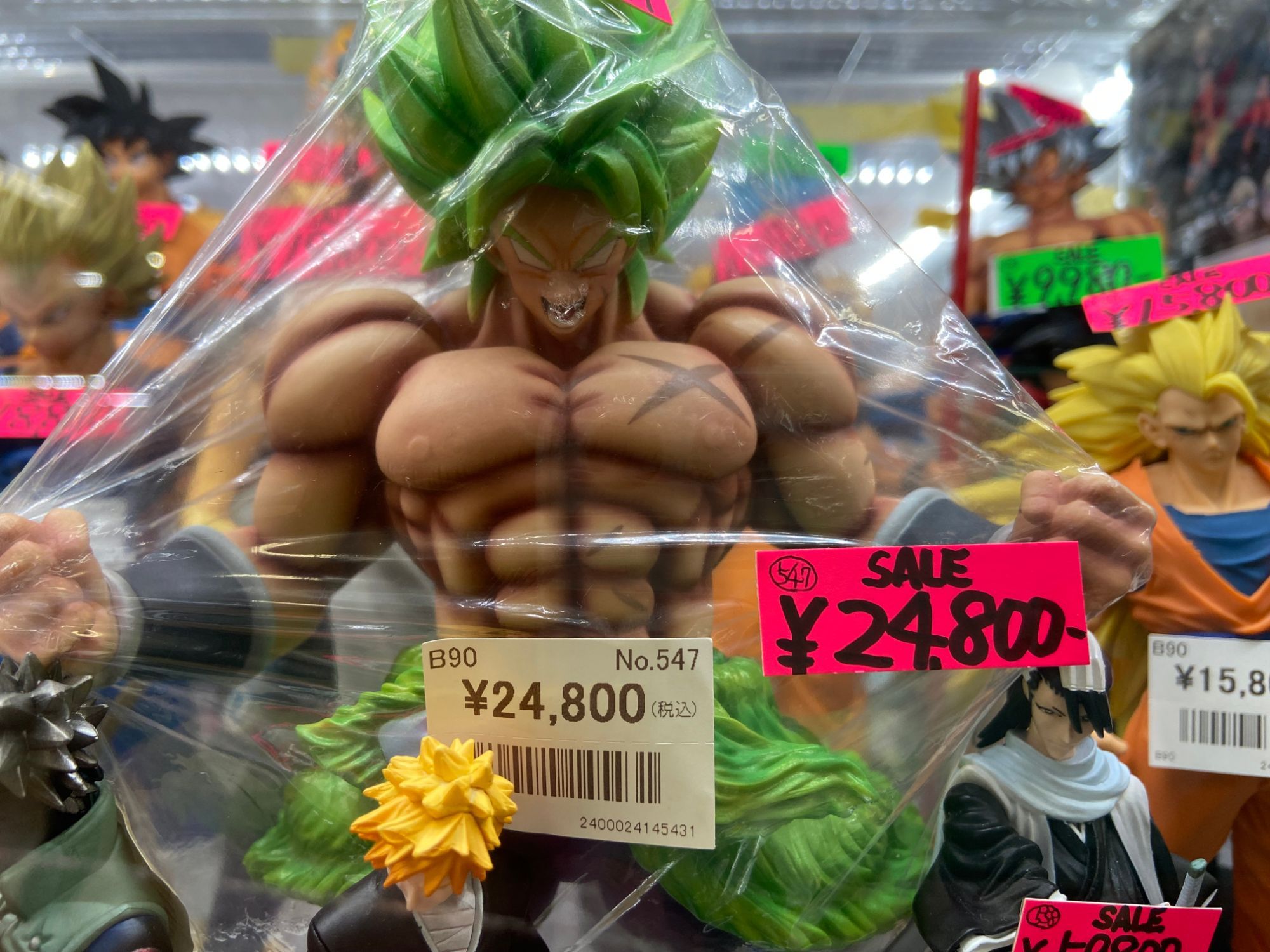 Dragon Ball figures with sale price tags in an Akihabara figure shop