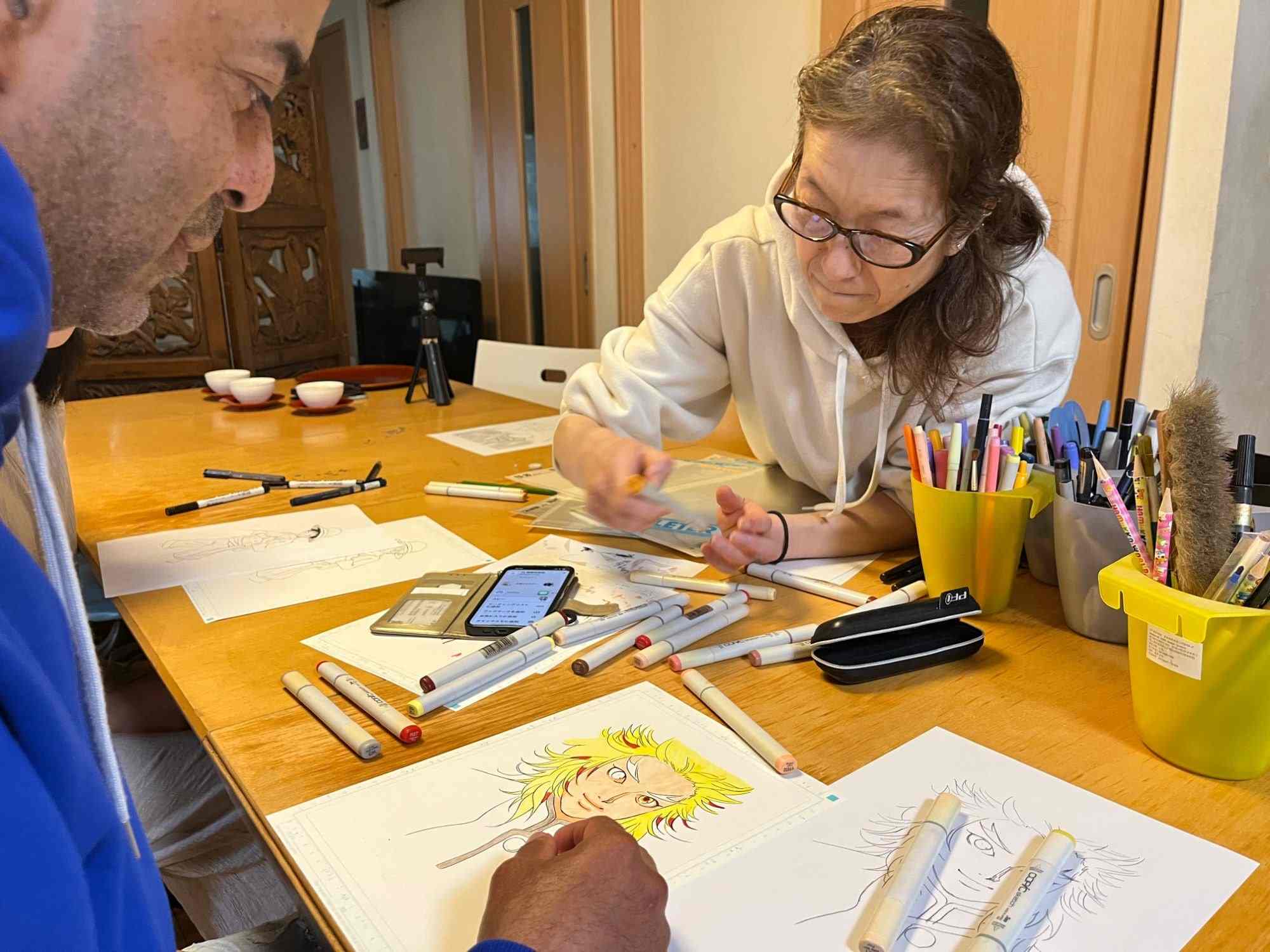 Yumiko-sensei, a working manga artist, teaching character drawing in her studio